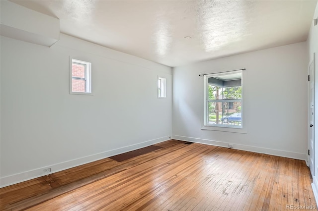 1654 S Pearl St, Denver, CO 80210 - empty room with plenty of natural light and light wood-type flooring