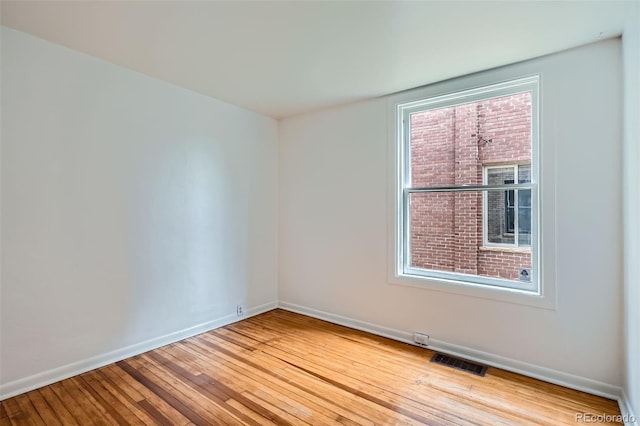 1654 S Pearl St, Denver, CO 80210 - empty room featuring baseboards and hardwood / wood-style floors
