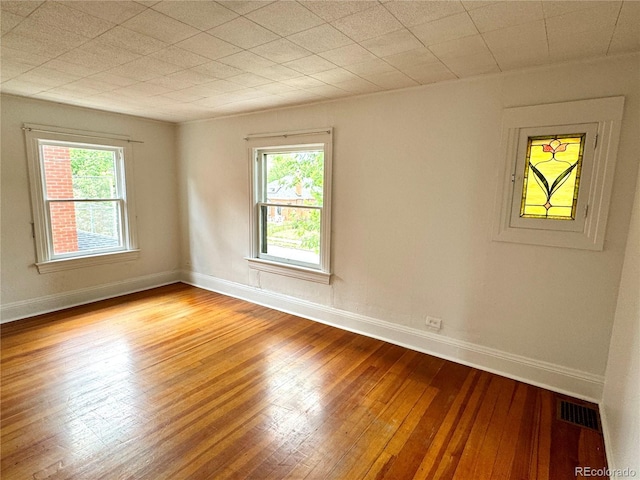 1654 S Pearl St, Denver, CO 80210 - empty room featuring light wood-style flooring and plenty of natural light