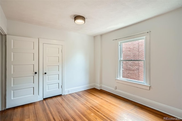 1654 S Pearl St, Denver, CO 80210 - spare room with light wood finished floors and healthy amount of natural light