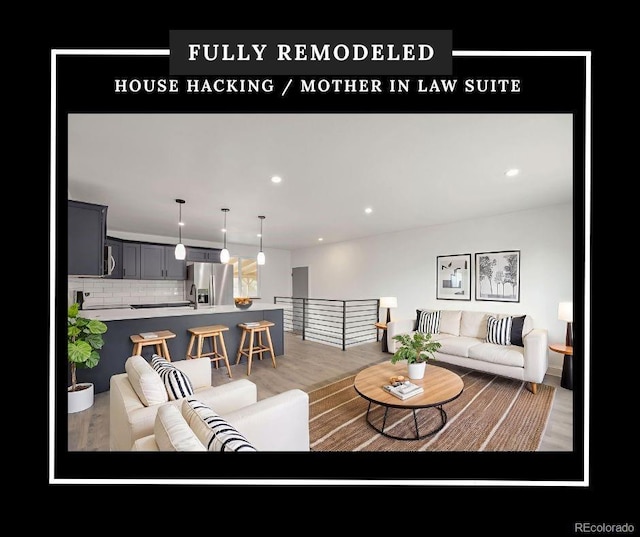 9008 Dover St, Broomfield, CO 80021 - living room featuring wood finished floors and recessed lighting