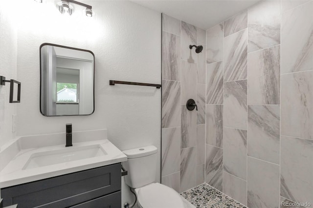 9008 Dover St, Broomfield, CO 80021 - bathroom featuring vanity and a tile shower