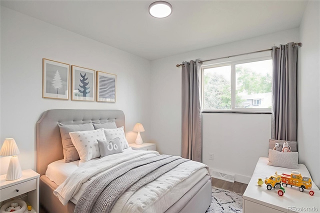 9008 Dover St, Broomfield, CO 80021 - bedroom with wood finished floors and baseboards