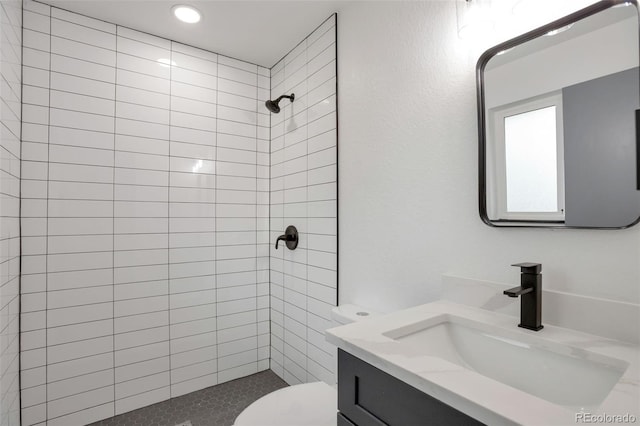 9008 Dover St, Broomfield, CO 80021 - full bath featuring tiled shower, vanity, and recessed lighting