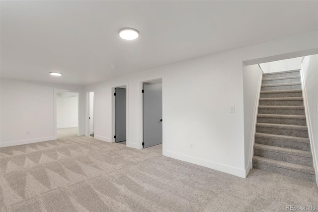 9008 Dover St, Broomfield, CO 80021 - finished basement featuring light colored carpet and stairway
