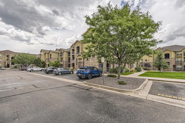 9180 Rolling Way Unit 303, Parker, CO 80134 - view of property featuring uncovered parking and a residential view