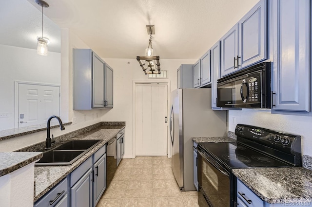 9180 Rolling Way Unit 303, Parker, CO 80134 - kitchen with black appliances, a sink, decorative light fixtures, blue cabinets, and dark stone countertops