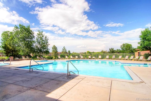 9180 Rolling Way Unit 303, Parker, CO 80134 - community pool featuring a patio area
