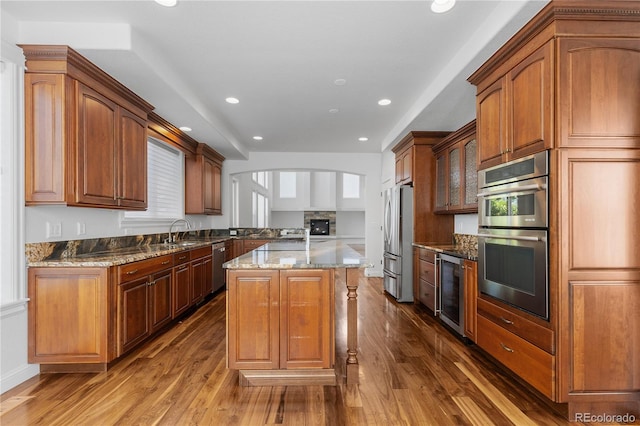 14325 N Santa Fe St, Broomfield, CO 80023 - kitchen featuring stainless steel appliances, beverage cooler, a center island, dark wood finished floors, and recessed lighting