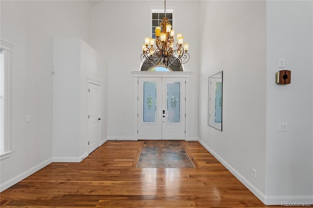 14325 N Santa Fe St, Broomfield, CO 80023 - foyer entrance featuring a chandelier, wood finished floors, and a towering ceiling