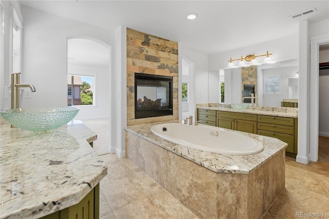 14325 N Santa Fe St, Broomfield, CO 80023 - bathroom with vanity, a bath, recessed lighting, and tile patterned floors