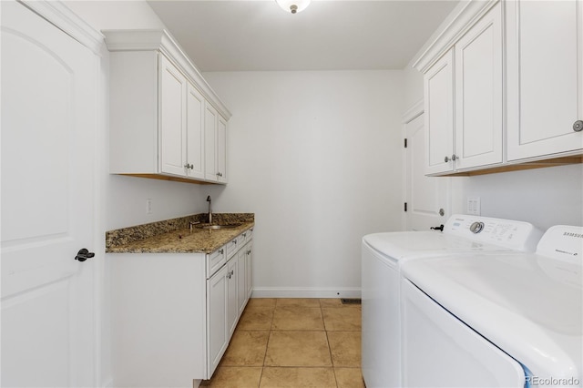 14325 N Santa Fe St, Broomfield, CO 80023 - washroom featuring cabinet space, independent washer and dryer, and light tile patterned flooring