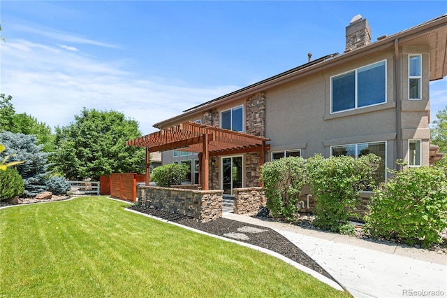 14325 N Santa Fe St, Broomfield, CO 80023 - back of property featuring stone siding, a pergola, a chimney, a yard, and stucco siding