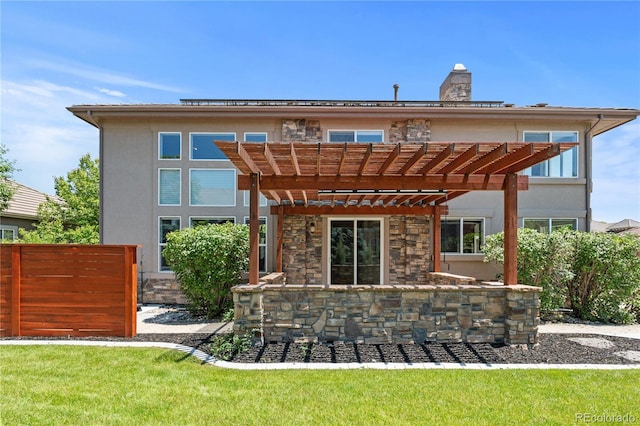 14325 N Santa Fe St, Broomfield, CO 80023 - back of property featuring a pergola, stucco siding, stone siding, and a chimney