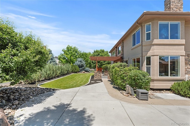 14325 N Santa Fe St, Broomfield, CO 80023 - view of green lawn featuring a patio area