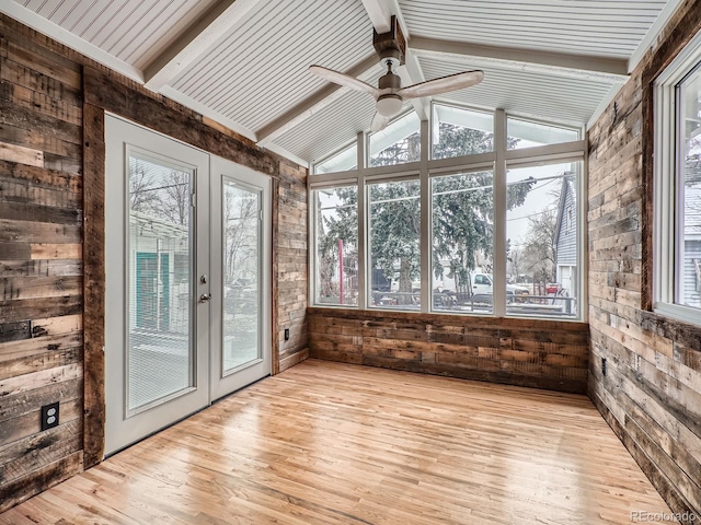 unfurnished sunroom featuring ceiling fan, french doors, and lofted ceiling with beams