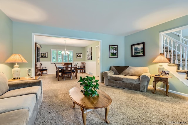 living area featuring stairway, carpet flooring, a chandelier, and baseboards