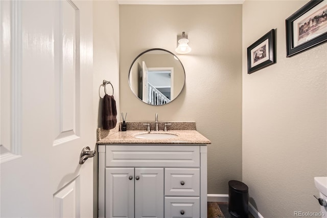 bathroom featuring vanity and baseboards