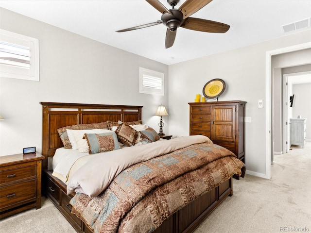 bedroom with light carpet, baseboards, and a ceiling fan
