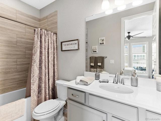 bathroom with toilet, ceiling fan, vanity, and shower / bath combo