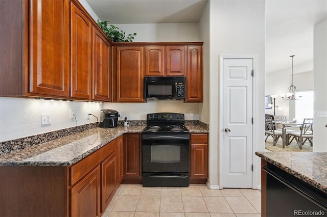 3742 E 127th Ln, Thornton, CO 80241 - kitchen with black appliances, dark stone countertops, light tile patterned flooring, and a chandelier