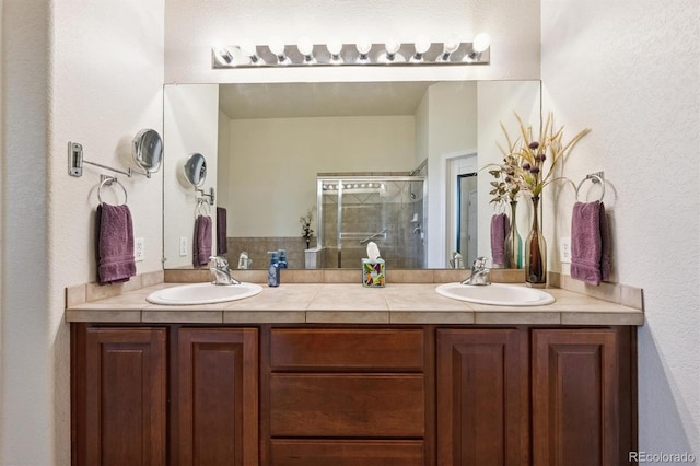 3742 E 127th Ln, Thornton, CO 80241 - full bath featuring double vanity, a shower stall, and a textured wall