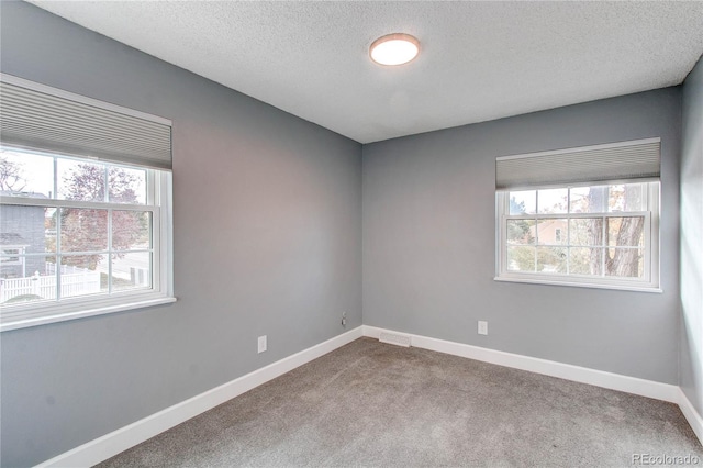 2790 S Wheeling Way, Aurora, CO 80014 - carpeted spare room with healthy amount of natural light and a textured ceiling