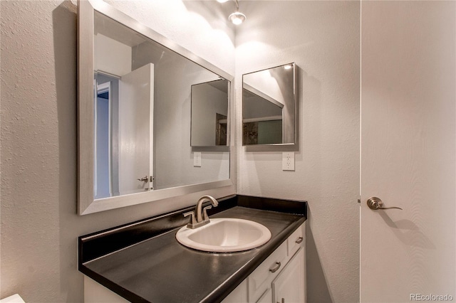 2790 S Wheeling Way, Aurora, CO 80014 - bathroom featuring vanity and a textured wall