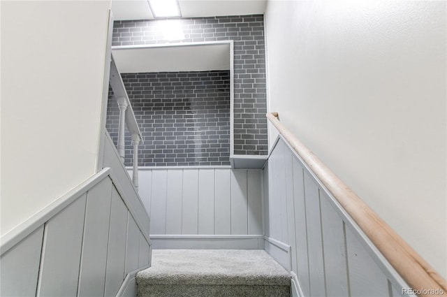 2790 S Wheeling Way, Aurora, CO 80014 - staircase with a decorative wall, a wainscoted wall, and carpet flooring
