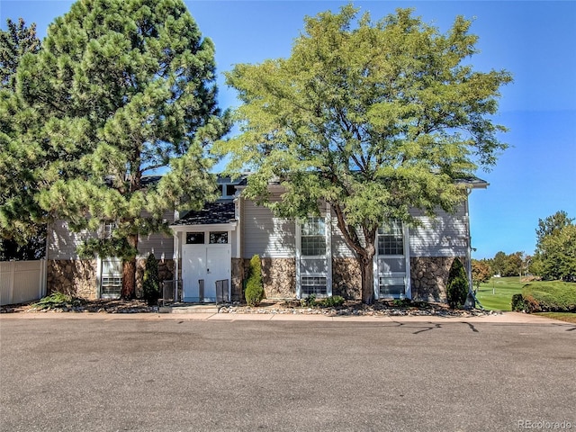 2790 S Wheeling Way, Aurora, CO 80014 - view of property hidden behind natural elements featuring stone siding