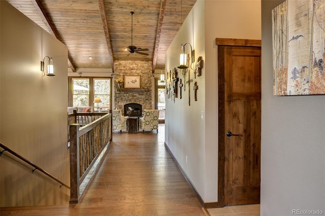 hallway with wood ceiling, vaulted ceiling with beams, and wood-type flooring