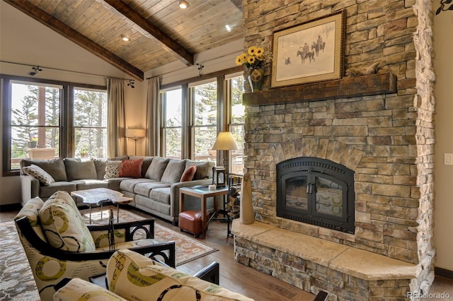 living room with beam ceiling, high vaulted ceiling, wood ceiling, a stone fireplace, and hardwood / wood-style flooring