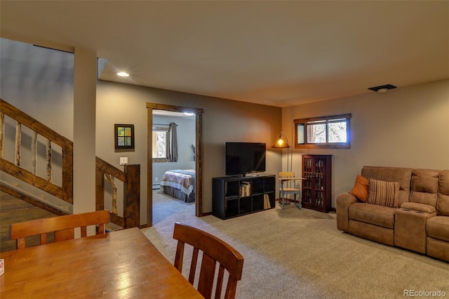 living room featuring light carpet