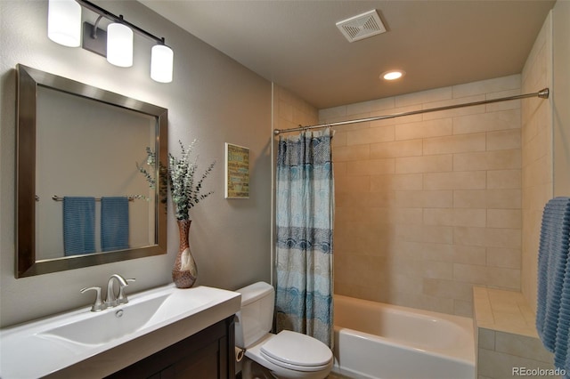 full bathroom featuring toilet, vanity, and shower / bath combo with shower curtain