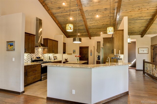 kitchen with vaulted ceiling with beams, backsplash, wood ceiling, decorative light fixtures, and stainless steel appliances