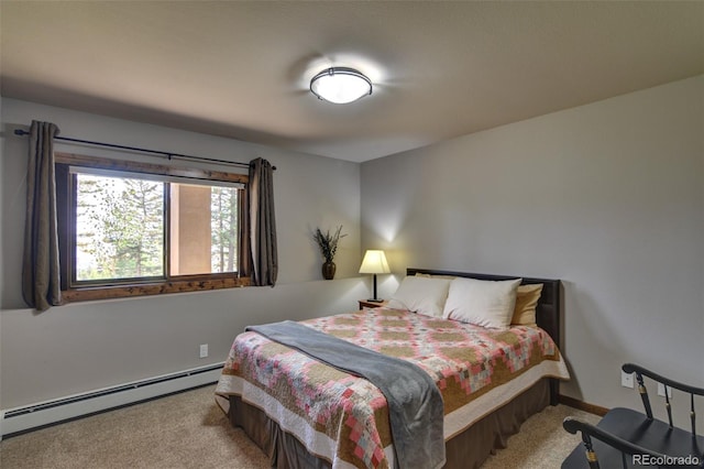 carpeted bedroom featuring a baseboard heating unit