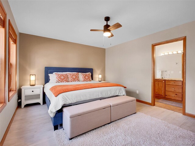 385 Pine Dr, Fairplay, CO 80440 - bedroom featuring ensuite bath, light wood-style flooring, baseboards, and a ceiling fan