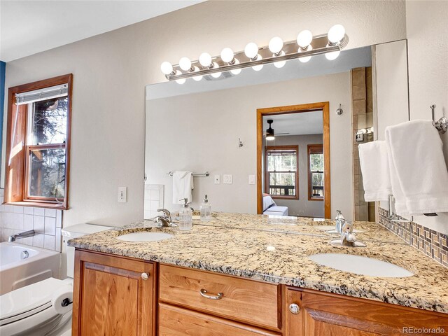 385 Pine Dr, Fairplay, CO 80440 - full bathroom featuring ceiling fan, a sink, double vanity, and connected bathroom