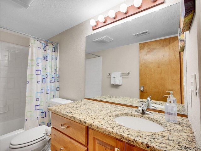 385 Pine Dr, Fairplay, CO 80440 - bathroom with visible vents, toilet, vanity, and shower / bath combo with shower curtain
