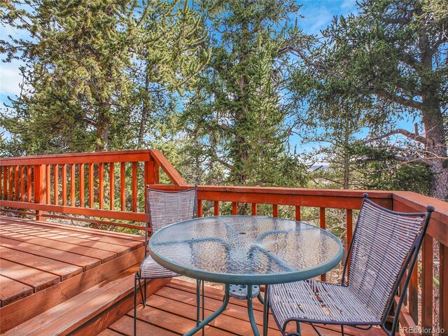 385 Pine Dr, Fairplay, CO 80440 - wooden deck featuring outdoor dining area
