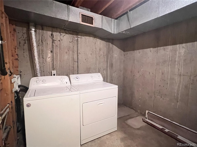 laundry area with washing machine and clothes dryer