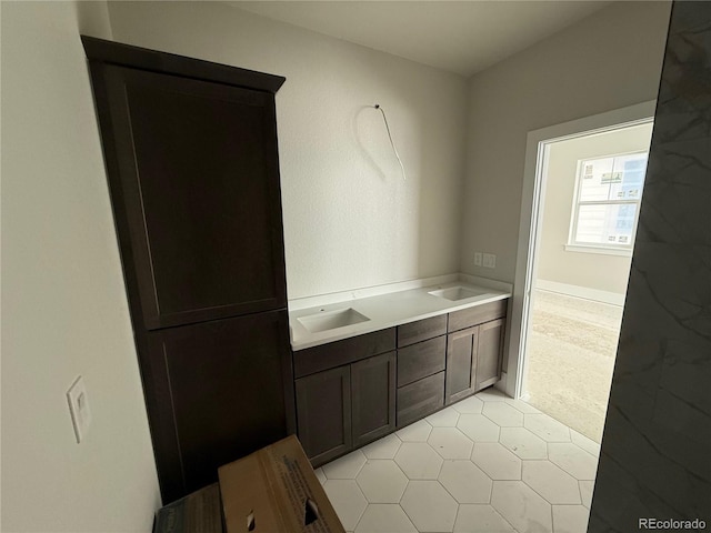 bathroom with vanity and tile patterned flooring