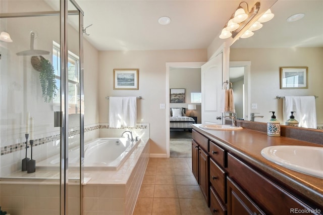 bathroom with tile patterned flooring, separate shower and tub, and vanity