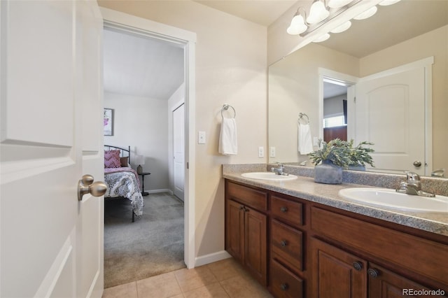 bathroom with tile patterned flooring and vanity