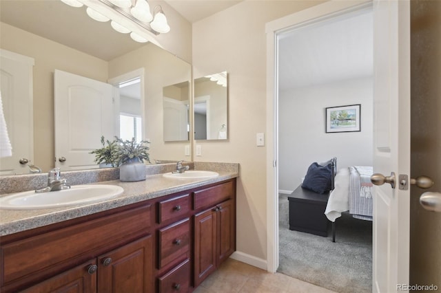 bathroom with tile patterned floors and vanity