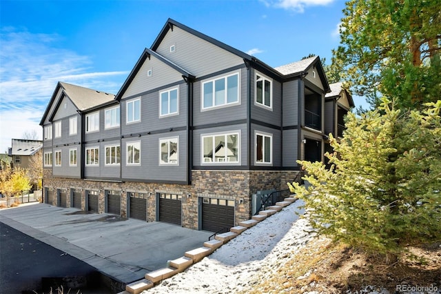 view of side of home featuring a garage