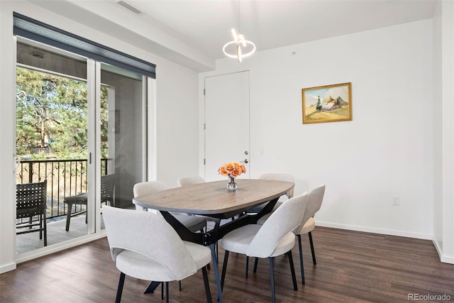 dining area with dark hardwood / wood-style floors