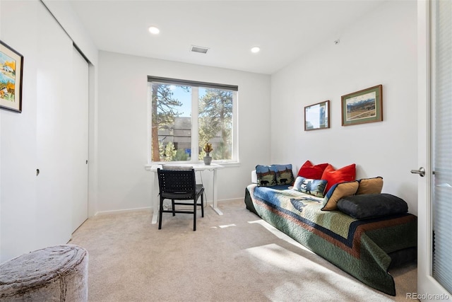 sitting room featuring light carpet