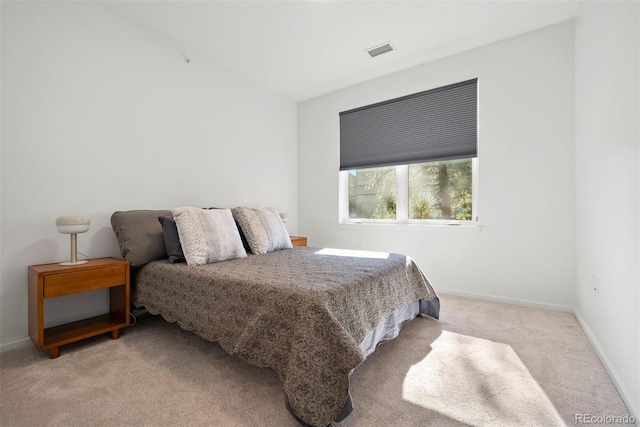 bedroom with light colored carpet