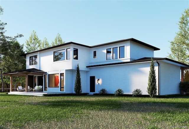 rear view of house featuring a yard and a patio